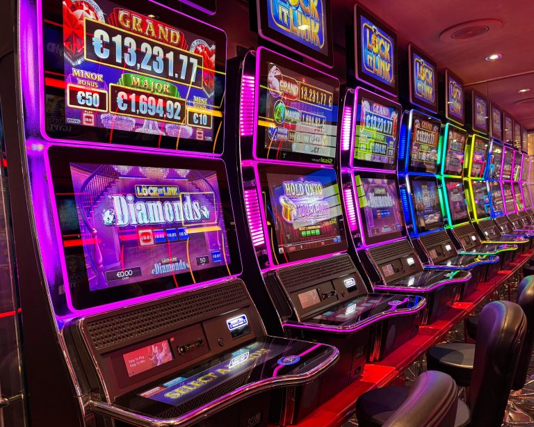 Hold-And-Win Explained: The Design Pattern You Keep Seeing Neon slot machines hold and win